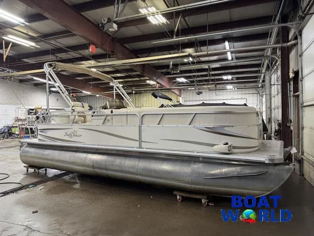Slide: The Image of 2008 SunChaser 8522 pontoon boat in a warehouse, labeled "Boat World." - 31