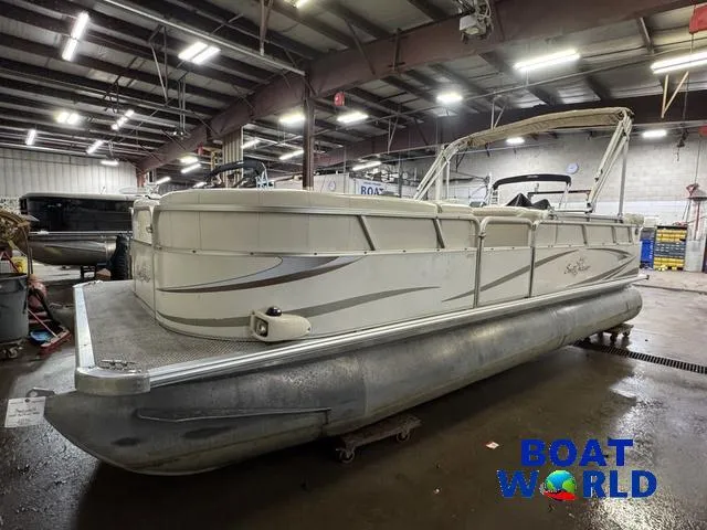 Slide: The Image of 2008 SunChaser 8522 pontoon boat in a warehouse, labeled "Boat World." - 35