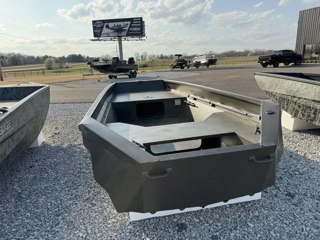 Slide: The Image of 2025 Edge Duck Boats 550 SPORTSMAN on gravel lot under clear sky. - 3