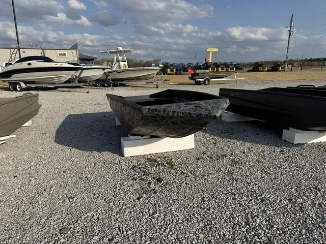 Slide: The Image of 2025 Edge Duck Boats 550 SPORTSMAN displayed outdoors on gravel lot. - 7