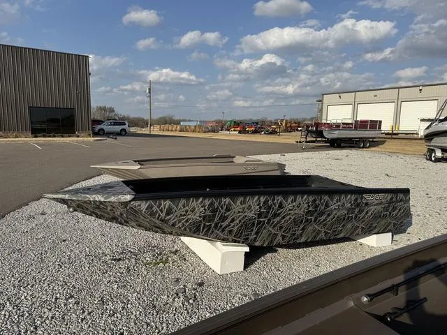 Slide: The Image of 2025 Edge Duck Boats 550 SPORTSMAN on display outdoors, featuring a camouflage design. - 8