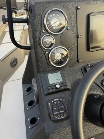 Slide: The Image of Dashboard of 2022 Excel Boats Bay Pro 220 with gauges and controls. - 9
