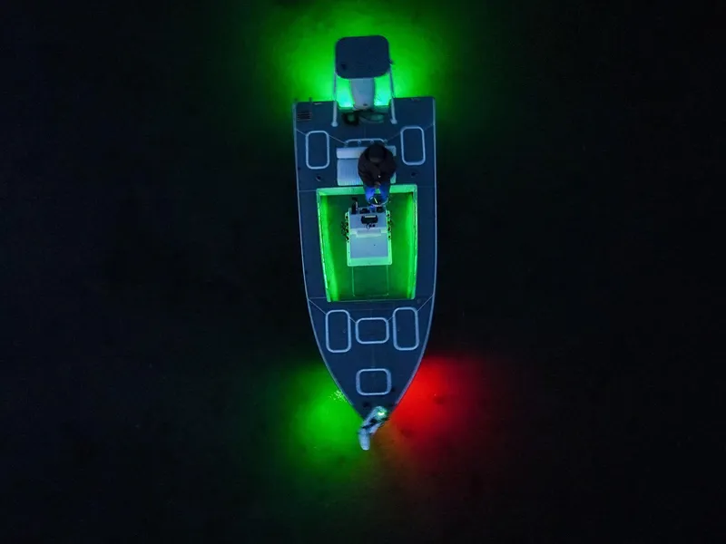 Slide: The Image of Aerial view of 1999 Flats and Bay 18x8 boat with green and red navigation lights. - 4