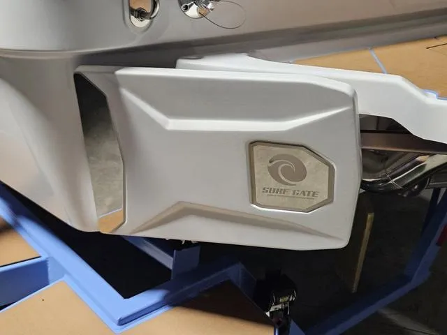 Slide: The Image of 2025 Malibu 23 LSV boat with Surf Gate feature, close-up view. - 11