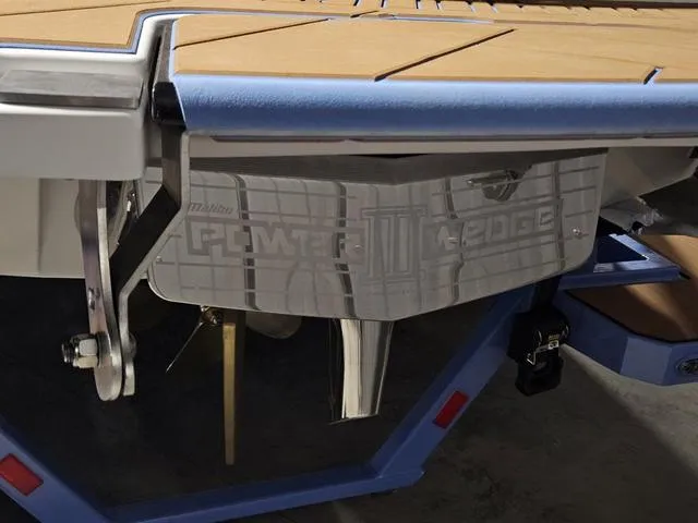 Slide: The Image of 2025 Malibu 23 LSV boat with Power Wedge feature, showcasing sleek design and advanced technology. - 12