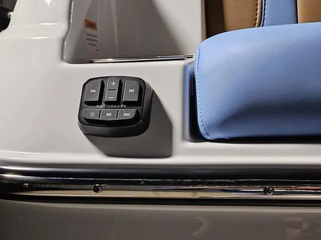 Slide: The Image of Control panel on 2025 Malibu 23 LSV boat with blue seating. - 15
