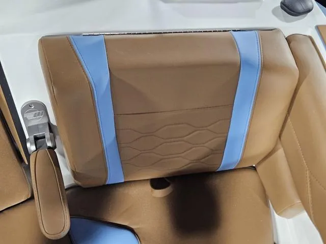 Slide: The Image of Brown and blue seat detail in 2025 Malibu 23 LSV boat interior. - 22