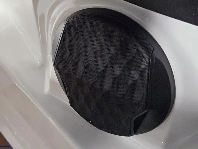 Slide: The Image of 2025 Malibu 23 LSV boat speaker with geometric design on white surface. - 45