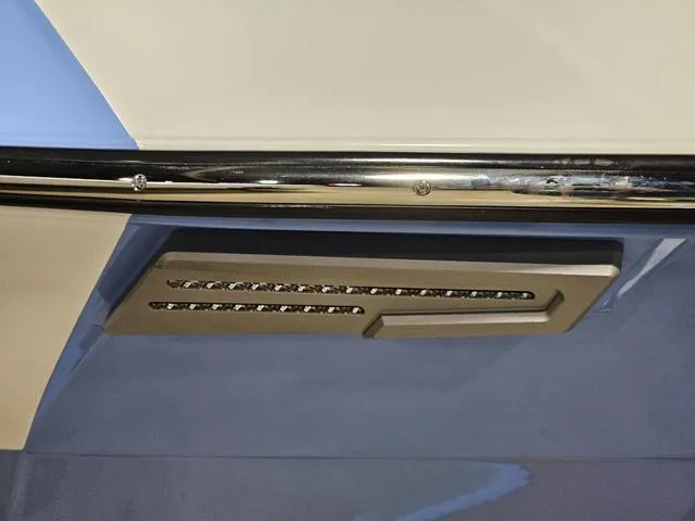 Slide: The Image of 2025 Malibu 23 LSV boat detail with sleek chrome and modern design elements. - 9