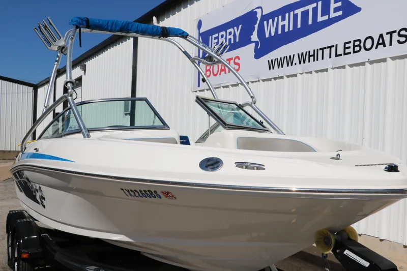 Slide: The Image of 2011 Sea Ray 205 Sport boat displayed at Jerry Whittle Boats dealership. - 12