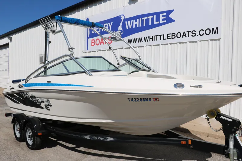 Slide: The Image of 2011 Sea Ray 205 Sport boat on trailer at Whittle Boats dealership. - 13
