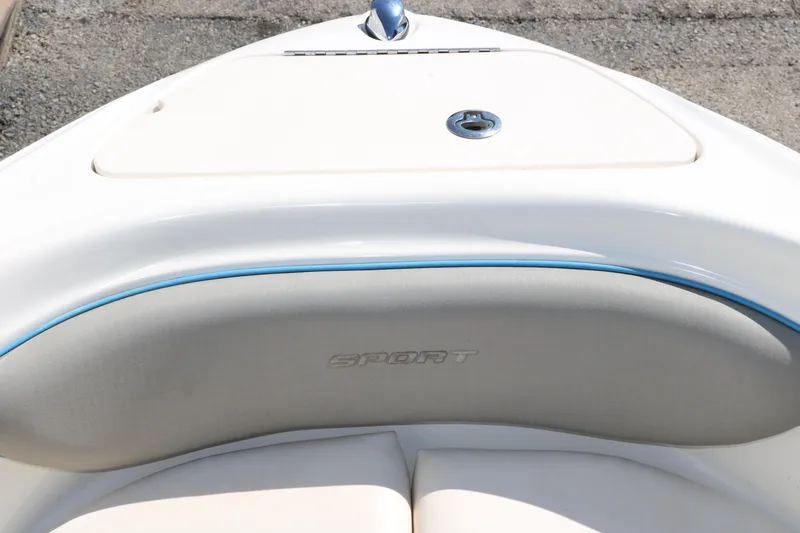 Slide: The Image of 2011 Sea Ray 205 Sport boat interior with blue and white seating. - 24