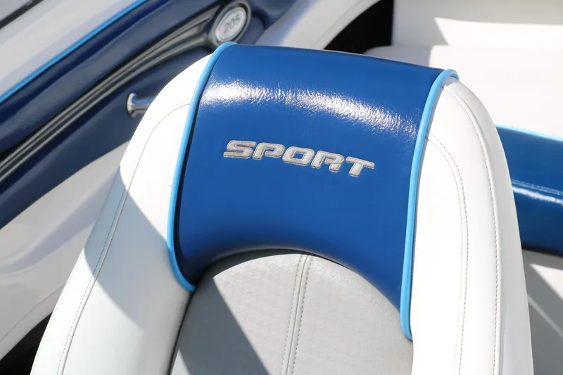 Slide: The Image of 2011 Sea Ray 205 Sport boat seat with blue and white upholstery. - 25