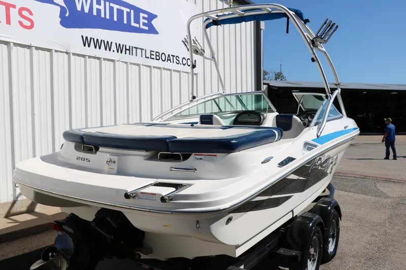 Slide: The Image of 2011 Sea Ray 205 Sport boat on trailer, displayed at Whittle Boats dealership. - 3
