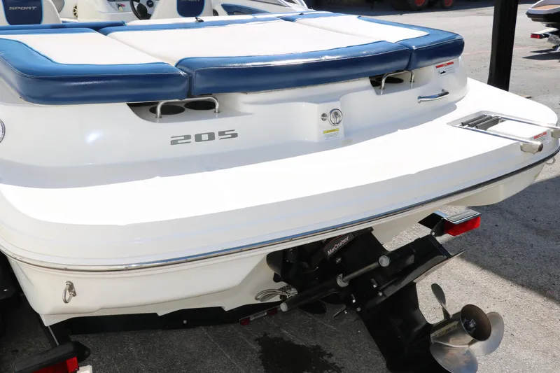 Slide: The Image of 2011 Sea Ray 205 Sport boat with sleek design and wakeboard tower. - 6