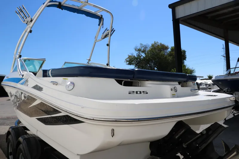 Slide: The Image of 2011 Sea Ray 205 Sport boat with sleek design and wakeboard tower. - 7