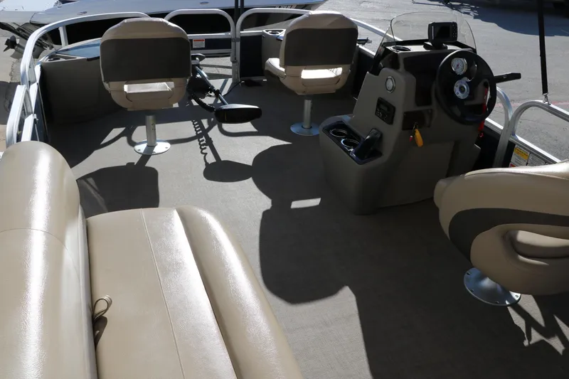 Slide: The Image of 2023 Sun Tracker 18 Bass Buggy interior with seating and steering console. - 22