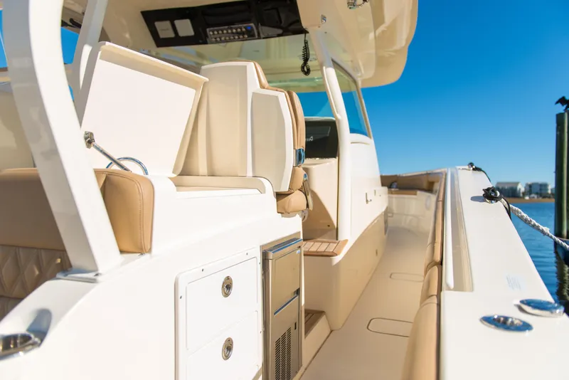 Slide: The Image of 2017 Scout 420 LXF boat interior with luxurious seating and modern amenities. - 37