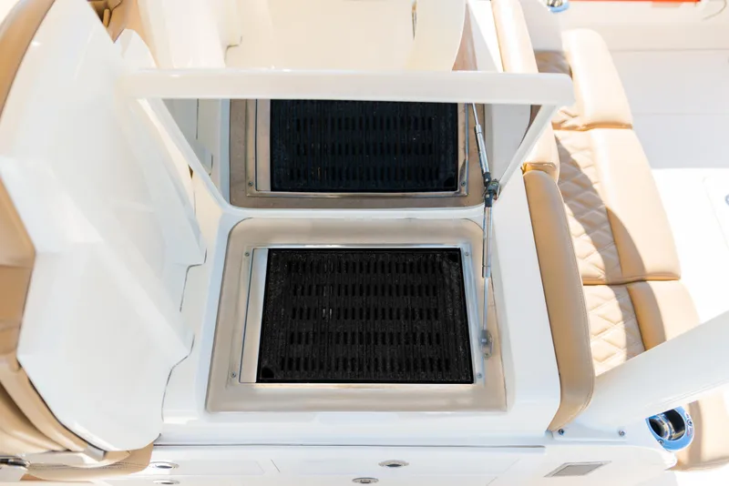 Slide: The Image of 2017 Scout 420 LXF boat seating and storage compartments. - 40
