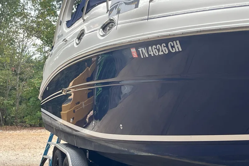 Slide: The Image of 2005 Sea Ray 280 Sundancer boat on trailer, side view with registration number. - 15