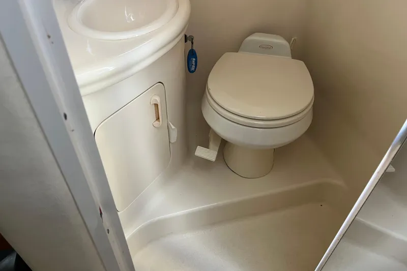 Slide: The Image of 2005 Sea Ray Sundancer 280 bathroom with toilet and sink. - 25
