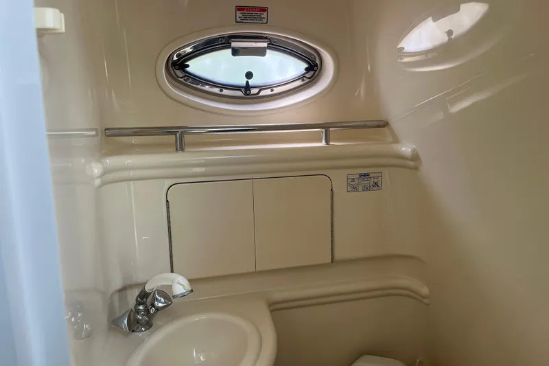 Slide: The Image of Compact bathroom in 2005 Sea Ray Sundancer 280 yacht with sink and porthole. - 26