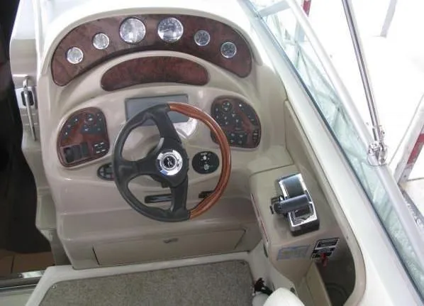 Slide: The Image of 2005 Sea Ray 280 Sundancer boat deck with railing on calm water. - 6