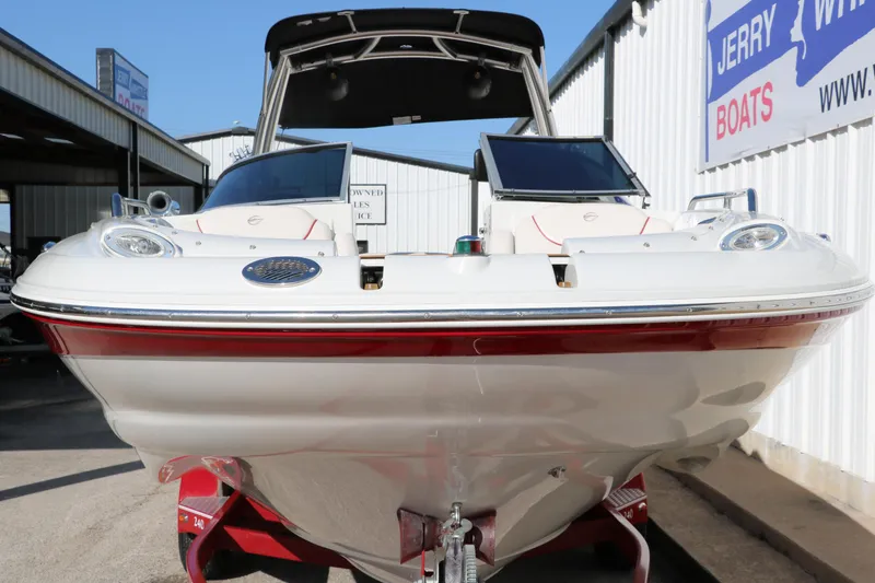 Slide: The Image of 2007 Crownline 240 EX boat on trailer at dealership, front view. - 10