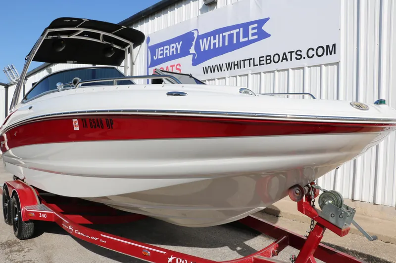 Slide: The Image of 2007 Crownline 240 EX boat on red trailer at Jerry Whittle Boats dealership. - 11