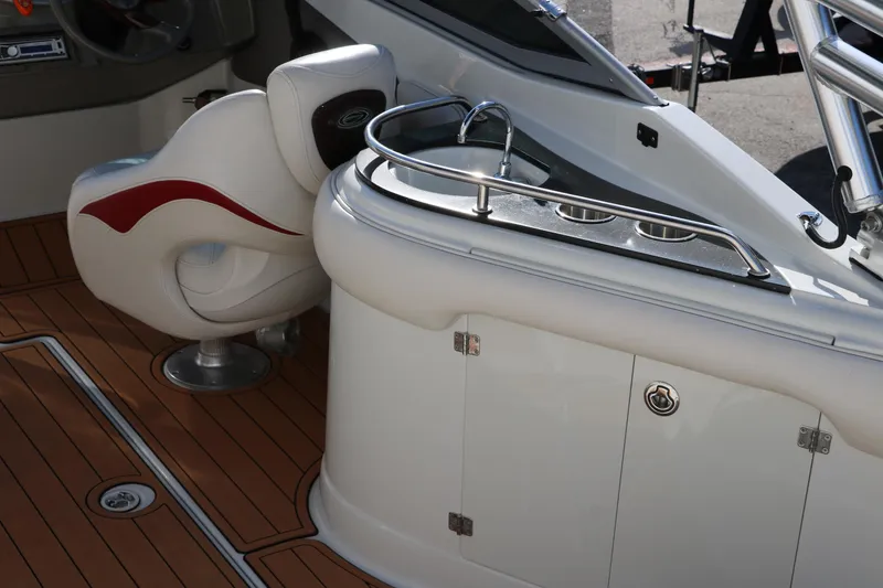Slide: The Image of 2007 Crownline 240 EX boat interior with seating and sink area. - 18