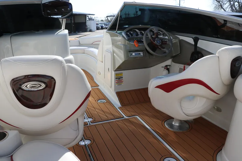Slide: The Image of Interior of a 2007 Crownline 240 EX boat with stylish seating and wood flooring. - 27
