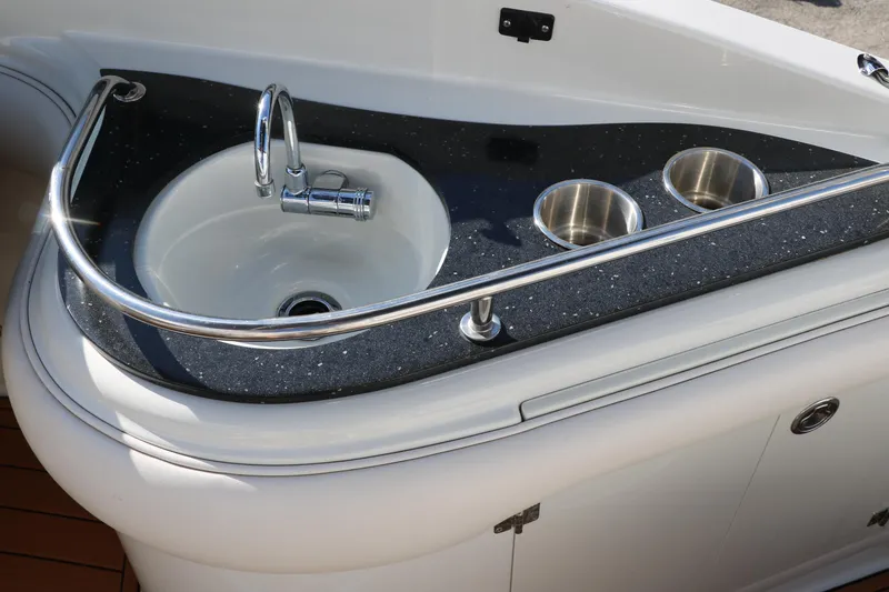Slide: The Image of 2007 Crownline 240 EX boat sink and cup holders on deck. - 31
