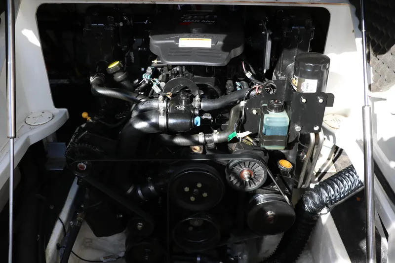Slide: The Image of Engine compartment of a 2007 Crownline 240 EX boat, showcasing mechanical components. - 35