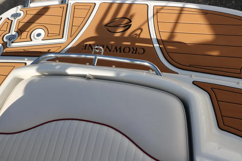 Slide: The Image of 2007 Crownline 240 EX boat deck with tan and white seating. - 37