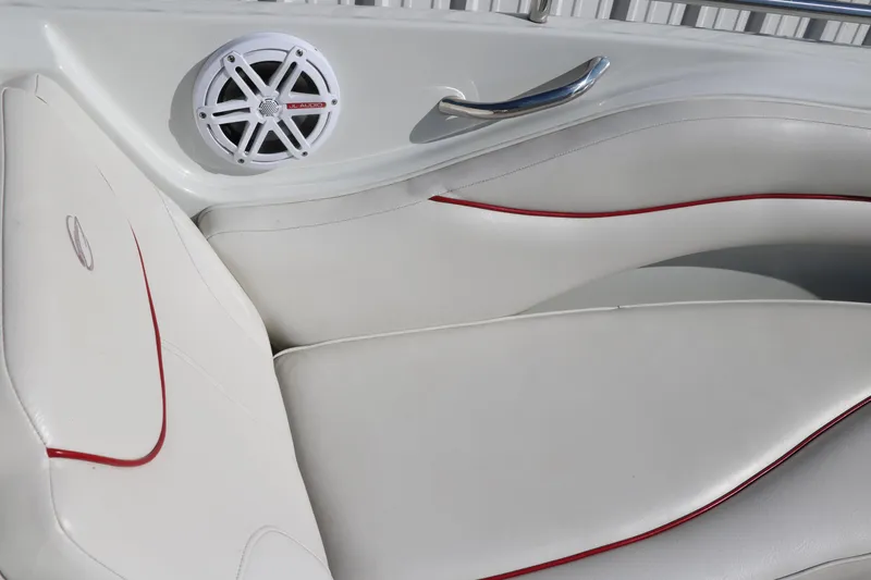 Slide: The Image of 2007 Crownline 240 EX boat interior with white seating and red accents. - 39
