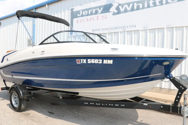 Slide: The Image of 2020 Bayliner VR5 Bowrider I/O on trailer, displayed at Jerry Whittle Boats dealership. - 13