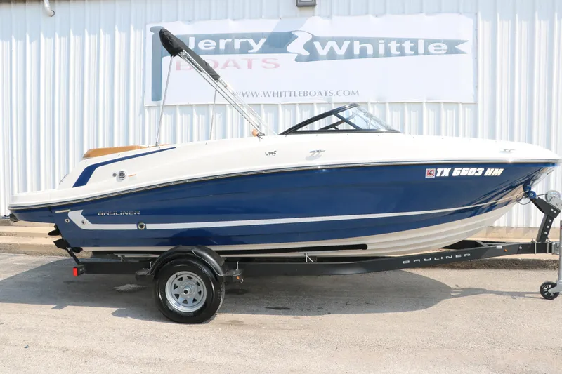 Slide: The Image of 2020 Bayliner VR5 Bowrider I/O boat on trailer, blue and white exterior. - 15