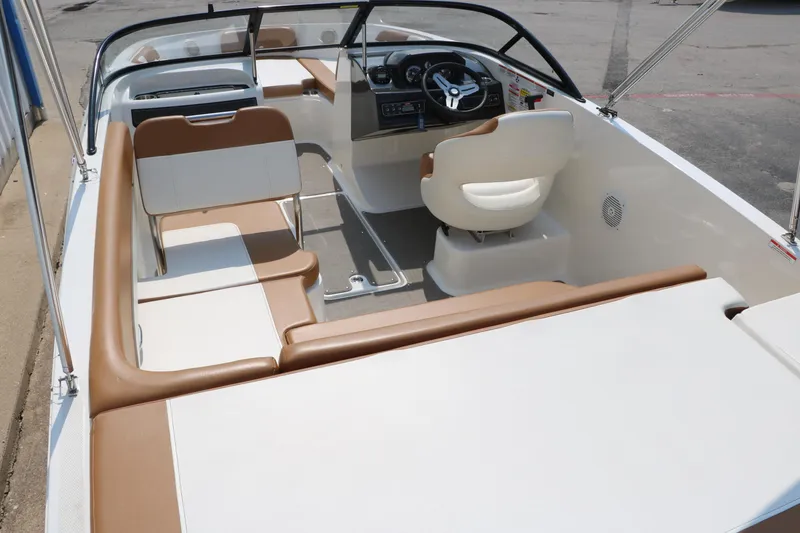Slide: The Image of 2020 Bayliner VR5 Bowrider I/O interior with beige and white seating. - 16