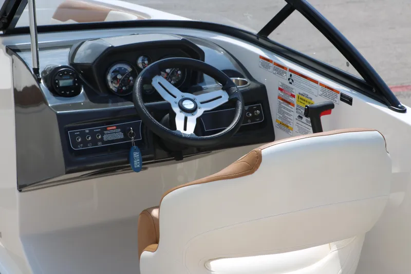 Slide: The Image of 2020 Bayliner VR5 Bowrider I/O dashboard with steering wheel and controls. - 18