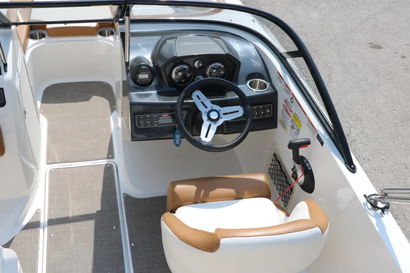 Slide: The Image of 2020 Bayliner VR5 Bowrider I/O cockpit with steering wheel and dashboard controls. - 21