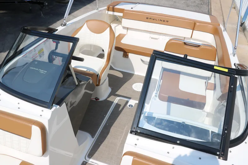 Slide: The Image of 2020 Bayliner VR5 Bowrider I/O interior with tan and white seating, open cockpit design. - 27