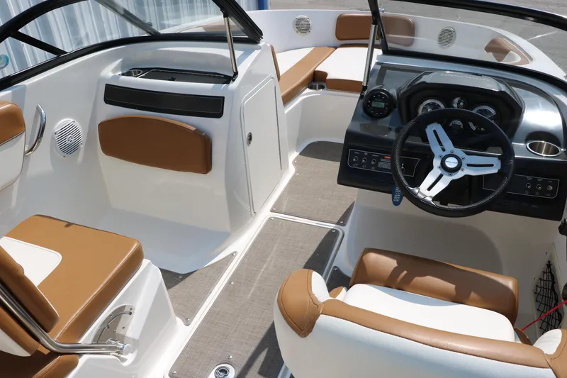 Slide: The Image of 2020 Bayliner VR5 Bowrider I/O interior with tan seating and modern dashboard. - 28