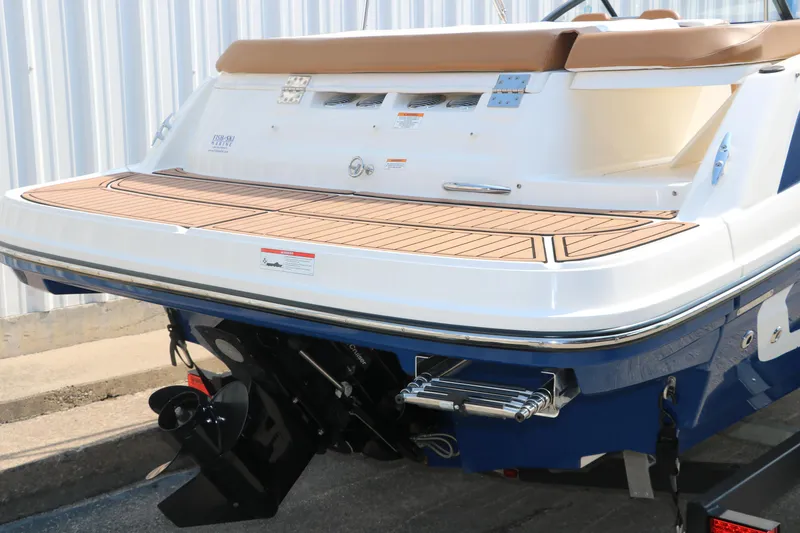 Slide: The Image of 2020 Bayliner VR5 Bowrider I/O boat stern with swim platform and outboard motor. - 4