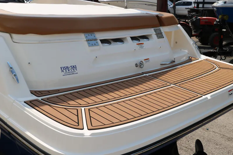Slide: The Image of 2020 Bayliner VR5 Bowrider I/O with teak swim platform, rear view. - 6