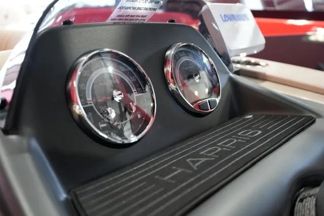 Slide: The Image of Dashboard of 2025 Harris Cruiser 210 boat with gauges and branding. - 8