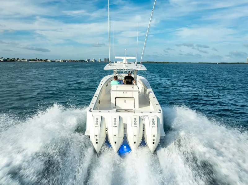 Slide: The Image of 2024 SeaVee 390B boat cruising on open water with powerful engines. - 0