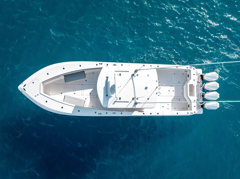 Slide: The Image of Aerial view of 2024 SeaVee 390B boat on clear blue water. - 1