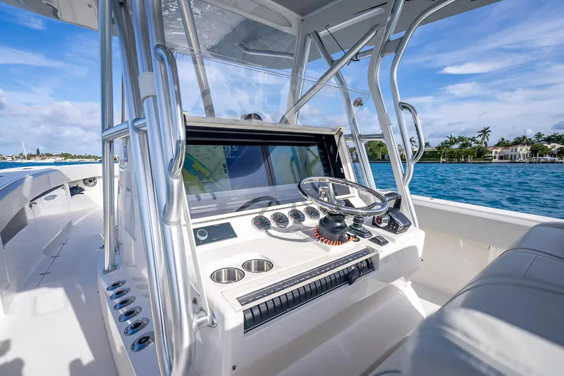 Slide: The Image of 2024 SeaVee 390B boat cockpit with modern controls and ocean view. - 17