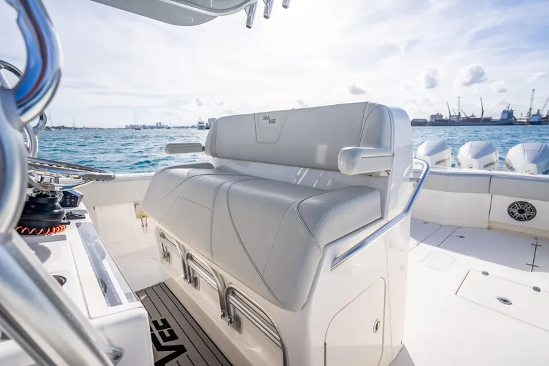 Slide: The Image of 2024 SeaVee 390B boat interior with cushioned seating, ocean view, and sleek design. - 21