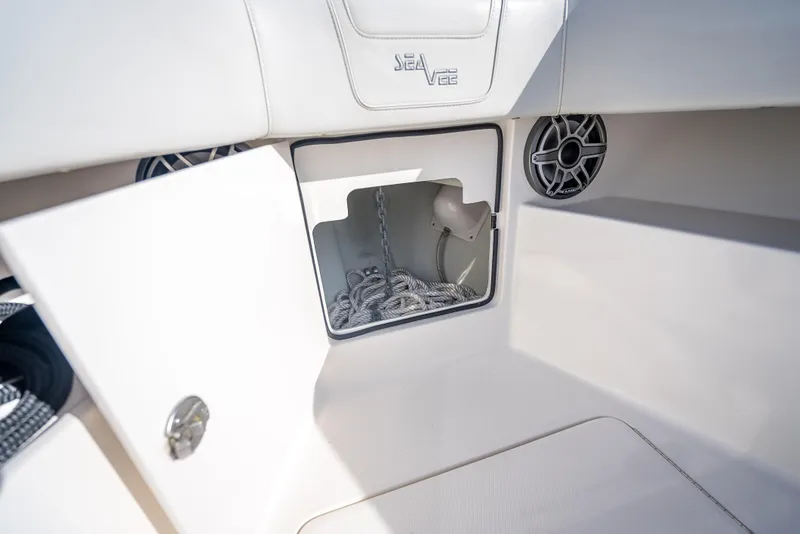 Slide: The Image of 2024 SeaVee 390B boat storage compartment with open hatch and visible anchor chain. - 30